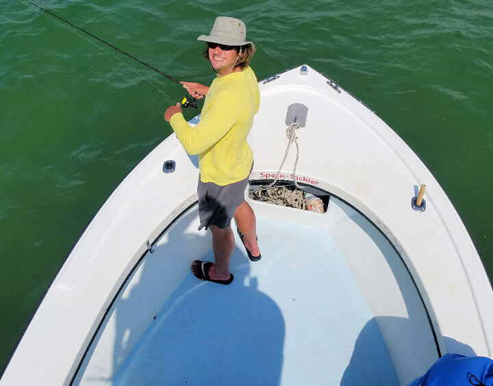 Lady angler fishing off the bow of Speck-Tackler in Hatteras Inlet on the Outer Banks.