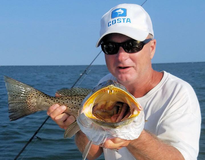 Capt. Scarborough holding up a nice Speckled Trout.