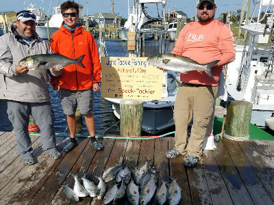 New York group standing with catch at the Teach's Lair Marina docks.