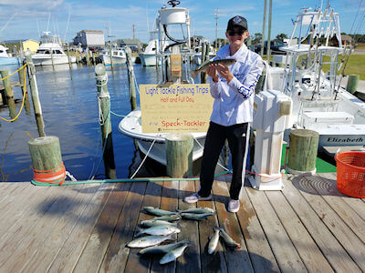 Young Haden standing with his catch.
