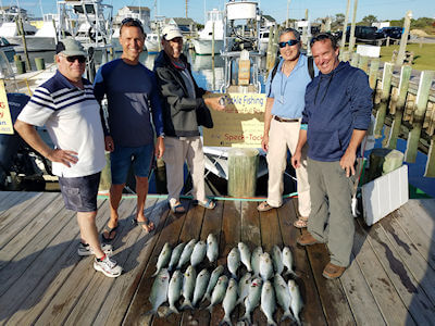 Young Haden standing with his catch.