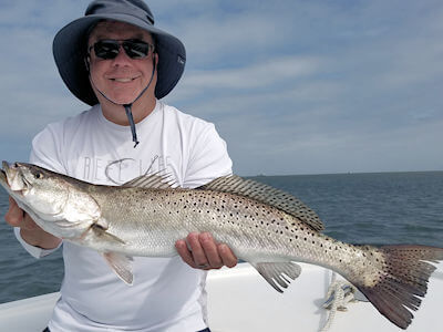 Hatteras angler holding fish for Pamlico Sound fishing reports page.