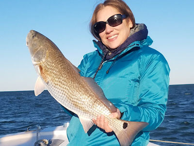 Jessica holding up a nice Redfish.