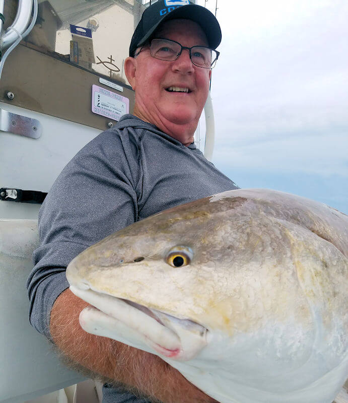 George holds his big Red Drum for a picture before it was released.