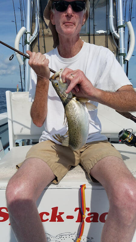 Bennett with his fiberglass Fenwick rod and a Spotted Seatrout.