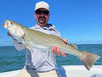 Hatteras angler holding fish for Pamlico Sound fishing reports page.